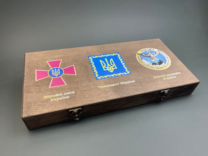 A set of coins with the autographs of President Zelensky and generals Zaluzhny and Budanov
